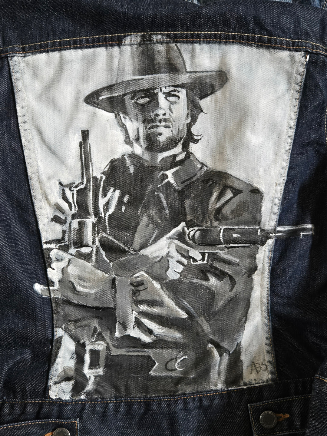 Close-up of airbrushed and hand-painted details on Clint Eastwood denim jacket