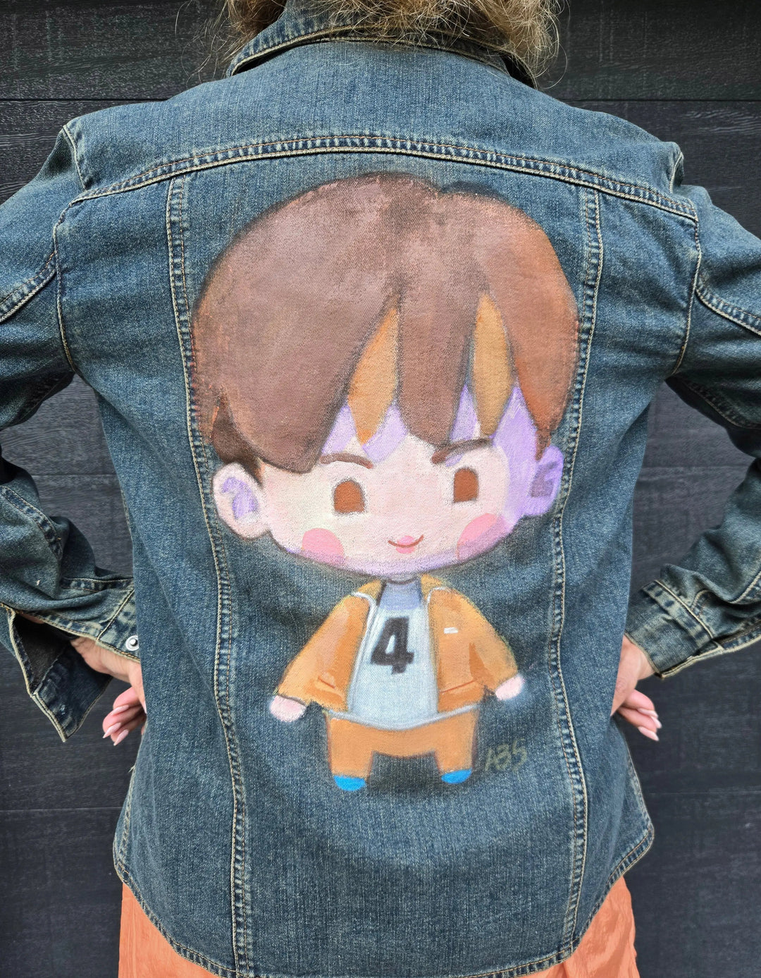 Airbrushed Jin SEOM chibi character design on denim jacket