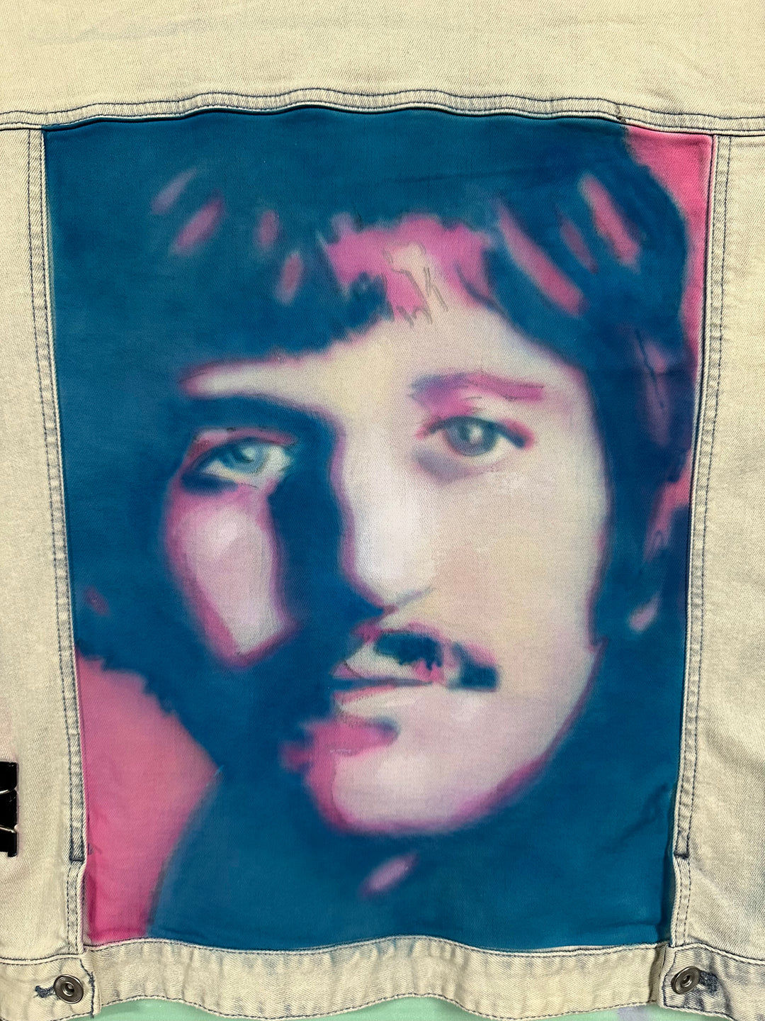 Custom airbrushed Ringo Starr design on laid flat denim jacket